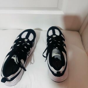 Nike Tech Hera, specifically the White/Black colorway (Style Code: FJ9532-101).